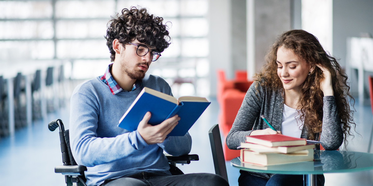 Two learners are reading in a library