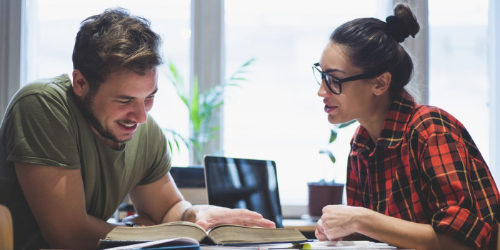 Two people reading indoors