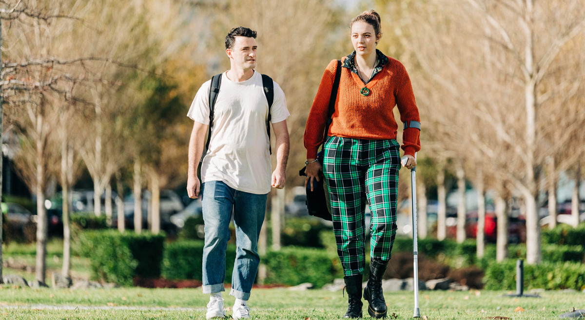 Two learners walking outside